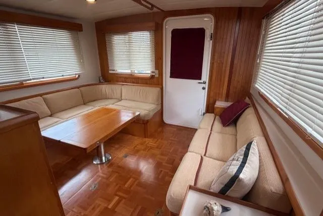 Slide: The Image of Luxurious 2005 Kadey-Krogen 44 yacht interior with cozy seating and elegant wood finishes. - 25