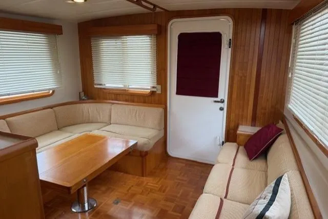 Slide: The Image of Interior of 2005 Kadey-Krogen 44 yacht with cozy seating and wooden accents. - 27