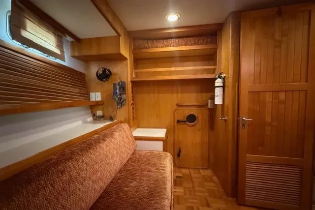 Slide: The Image of Cozy interior of 2005 Kadey-Krogen 44 yacht with wooden furnishings and seating area. - 29