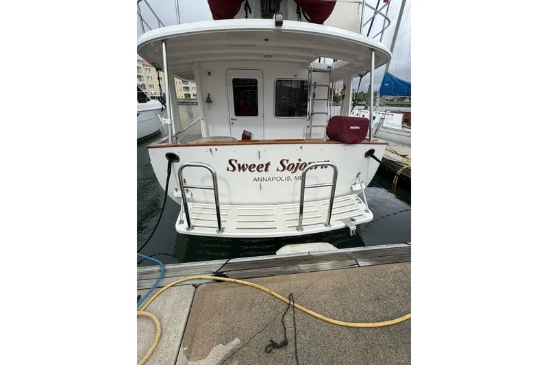 Slide: The Image of Kadey-Krogen 44 boat docked, rear view, named "Sweet Sojourn," Annapolis, Maryland, 2005 model. - 3
