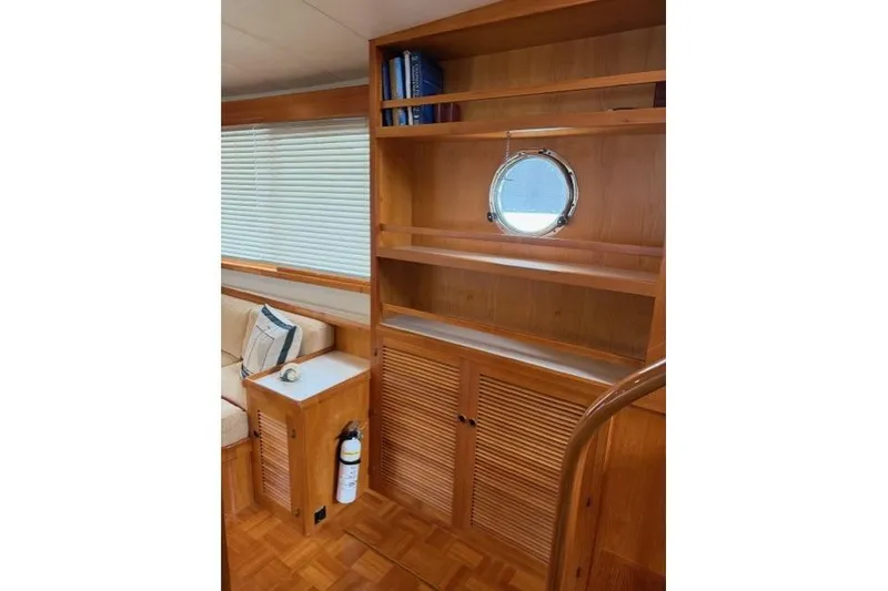 Slide: The Image of Interior of 2005 Kadey-Krogen 44 yacht with wooden cabinetry and porthole window. - 30