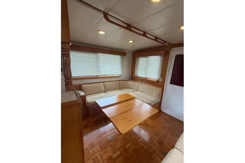 Slide: The Image of Interior of 2005 Kadey-Krogen 44 yacht with cozy seating and wooden table. - 32