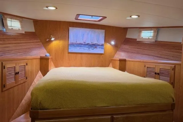 Slide: The Image of Cozy cabin interior of 2005 Kadey-Krogen 44 yacht with wooden accents and a comfortable bed. - 37