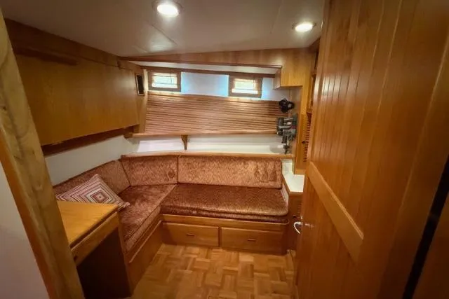 Slide: The Image of Cozy interior of 2005 Kadey-Krogen 44 yacht with wood paneling and cushioned seating. - 38