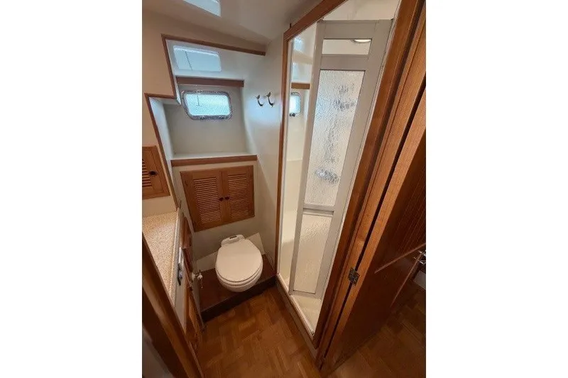 Slide: The Image of Bathroom interior of 2005 Kadey-Krogen 44 yacht with shower and toilet. - 44
