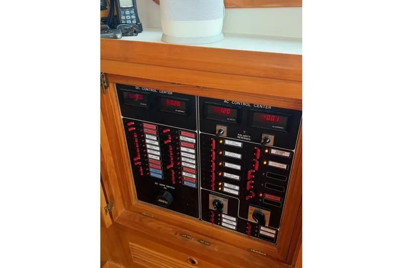 Slide: The Image of Electrical control panel on a 2005 Kadey-Krogen 44 boat, featuring AC and DC systems. - 48