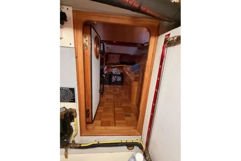 Slide: The Image of Interior view of a 2005 Kadey-Krogen 44 yacht, showcasing wooden door and cozy cabin. - 50