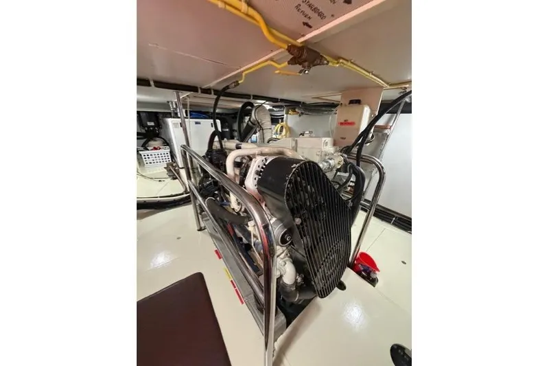 Slide: The Image of Engine room of a 2005 Kadey-Krogen 44 yacht, showcasing mechanical components. - 51