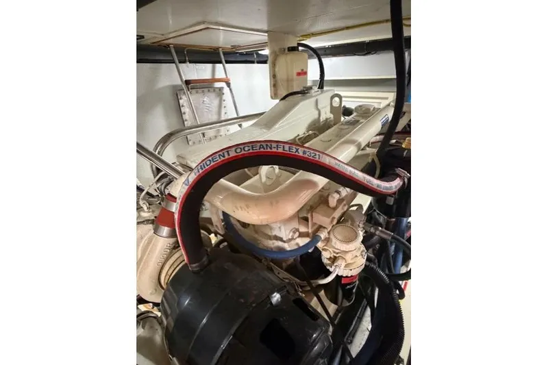 Slide: The Image of Engine room of 2005 Kadey-Krogen 44 with Trident Ocean-Flex hose visible. - 55