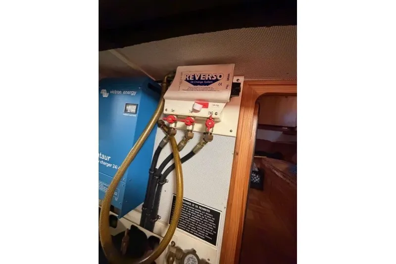 Slide: The Image of Engine room of 2005 Kadey-Krogen 44 with Reverso oil change system and Victron Energy charger. - 58