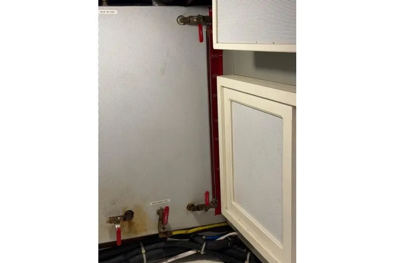 Slide: The Image of Engine room of a 2005 Kadey-Krogen 44 yacht with valves and pipes. - 59