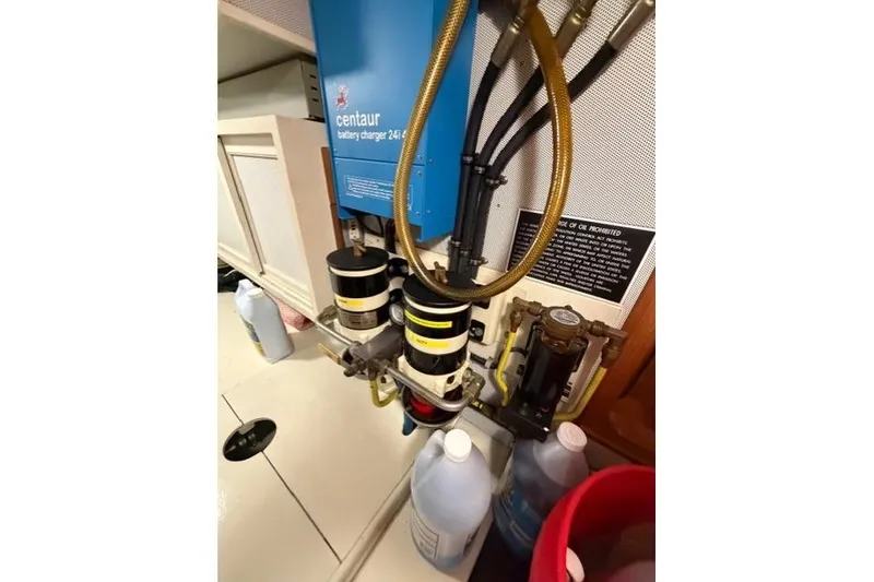 Slide: The Image of Battery charger and filters in a 2005 Kadey-Krogen 44 yacht engine room. - 60