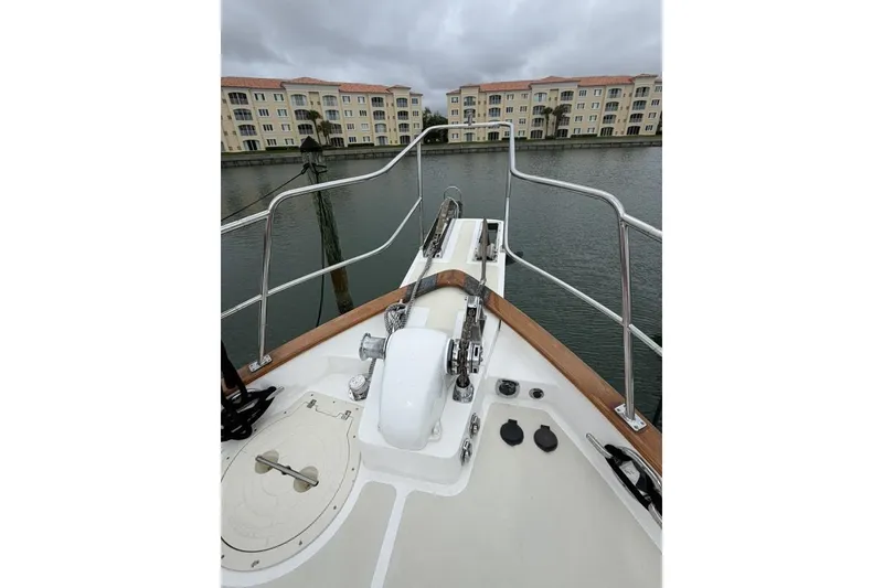 Slide: The Image of Bow view of 2005 Kadey-Krogen 44 yacht docked near waterfront buildings. - 8