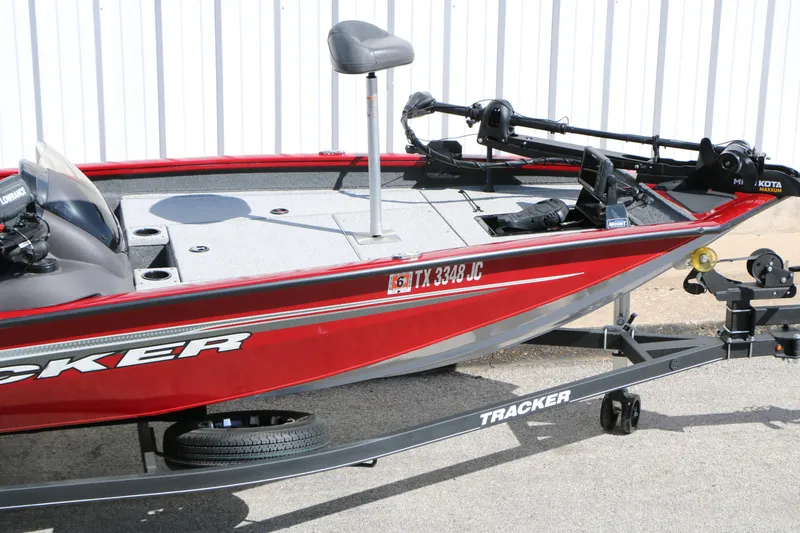 Slide: The Image of 2020 Tracker Pro Team 175 TXW Tournament Edition boat on trailer, red exterior. - 13