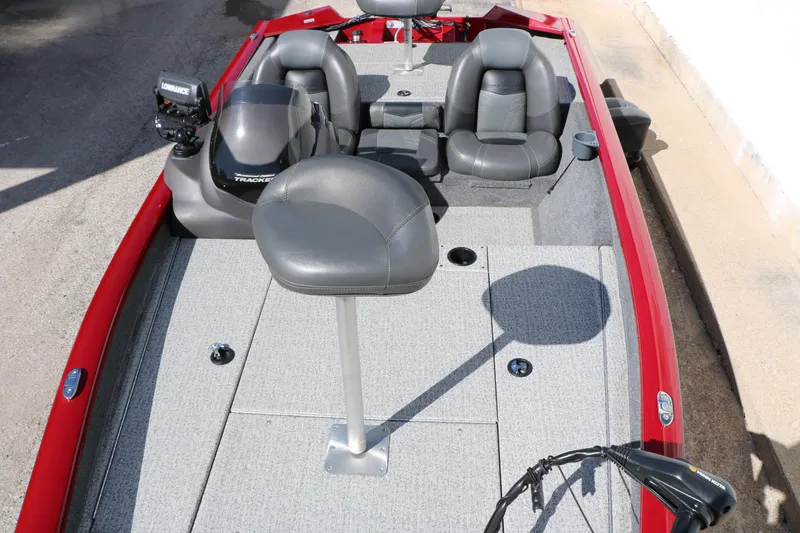 Slide: The Image of 2020 Tracker Pro Team 175 TXW Tournament Edition boat with gray seating and red exterior. - 20