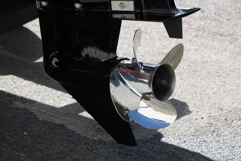 Slide: The Image of 2020 Tracker Pro Team 175 TXW Tournament Edition boat propeller on pavement. - 7