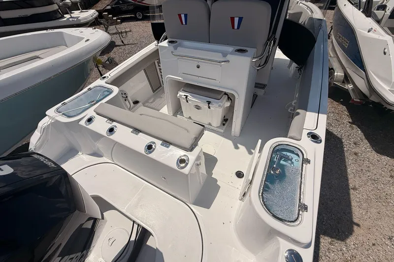Slide: The Image of 2026 Wellcraft 243 Fisherman boat interior with seating and storage compartments. - 12