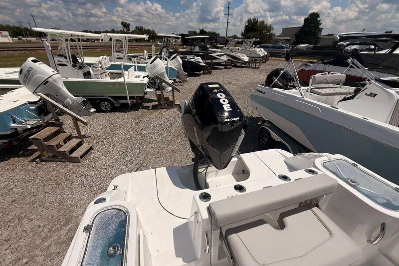 Slide: The Image of 2026 Wellcraft 243 Fisherman boat with Mercury 300 engine in a dealership lot. - 20