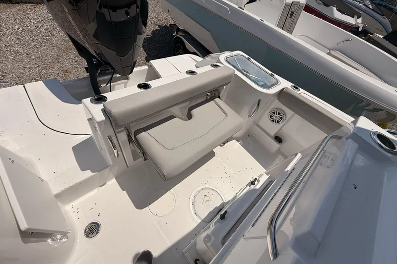 Slide: The Image of 2026 Wellcraft 243 Fisherman boat interior with seating and storage compartments. - 21