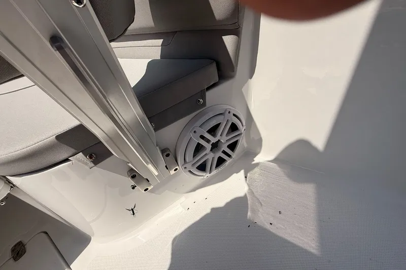 Slide: The Image of Interior of 2026 Wellcraft 243 Fisherman boat featuring seating and speaker system. - 25