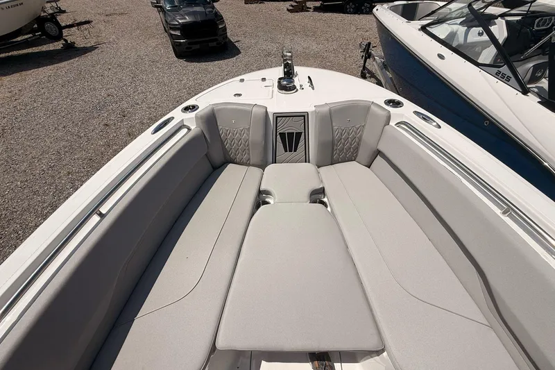 Slide: The Image of 2026 Wellcraft 243 Fisherman boat interior with cushioned seating and sleek design. - 26