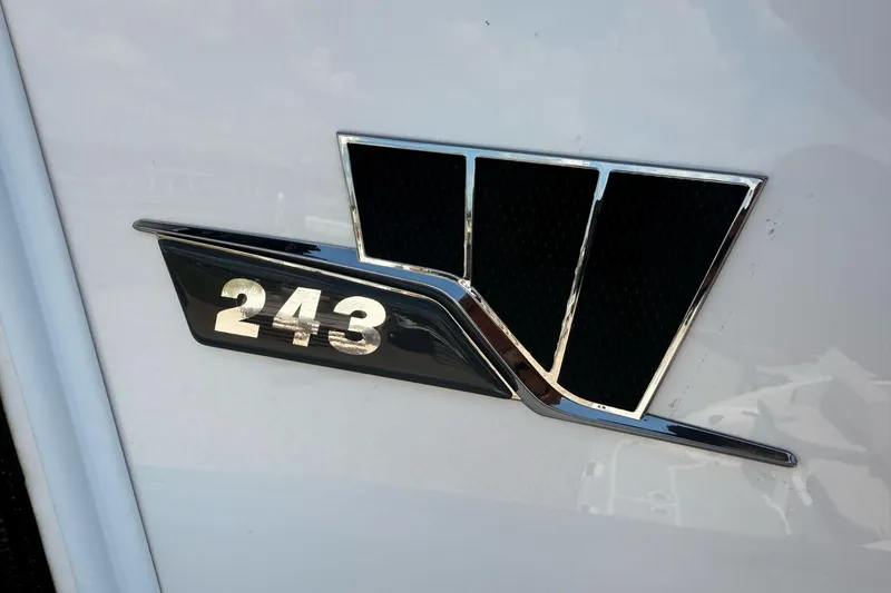 Slide: The Image of 2026 Wellcraft 243 Fisherman logo on a sleek white surface. - 31