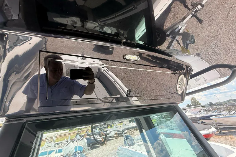 Slide: The Image of Reflection on Wellcraft 243 Fisherman 2026 boat console, showcasing sleek design and outdoor setting. - 34