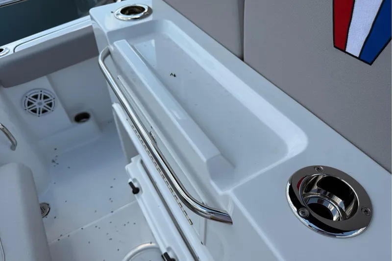 Slide: The Image of Interior of 2026 Wellcraft 243 Fisherman boat, featuring seating and cup holders. - 39
