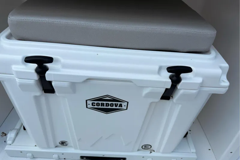 Slide: The Image of White Cordova cooler with cushioned seat on Wellcraft 243 Fisherman, 2026 model. - 41