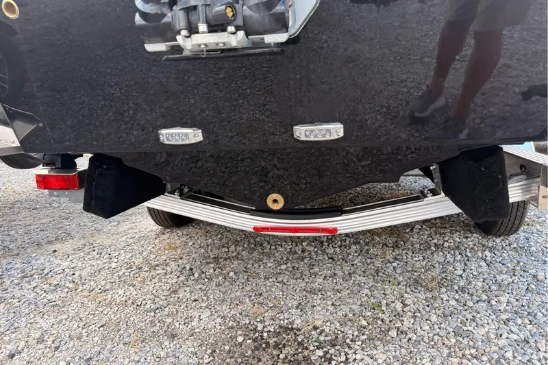 Slide: The Image of Rear view of 2026 Wellcraft 243 Fisherman boat on a trailer, showing hull and lights. - 43