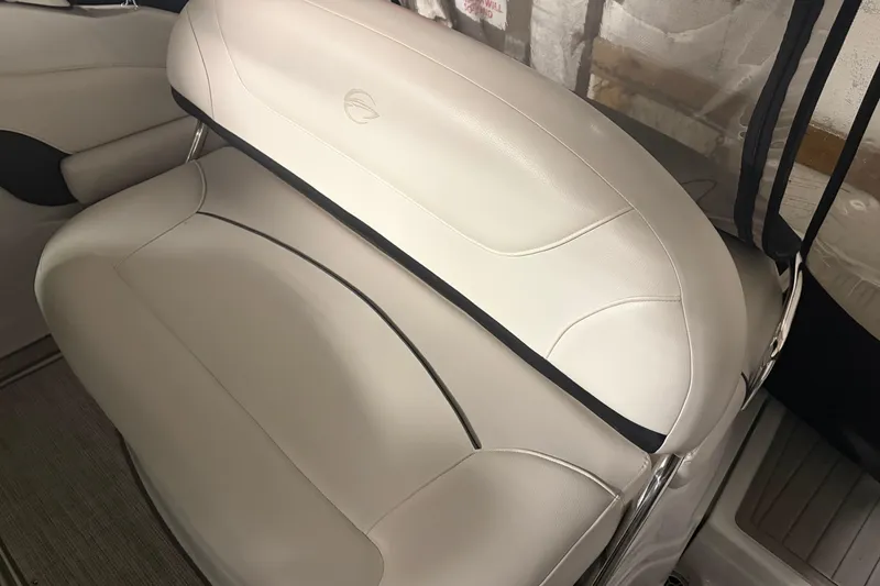 Slide: The Image of 2021 Crownline 264 CR boat interior with white leather seating. - 11