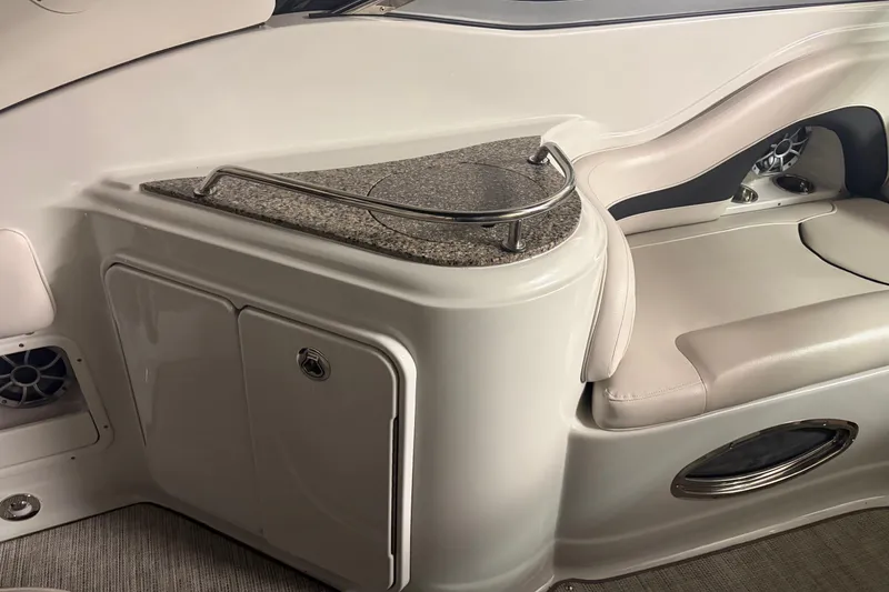 Slide: The Image of 2021 Crownline 264 CR boat interior with sleek seating and granite countertop. - 16