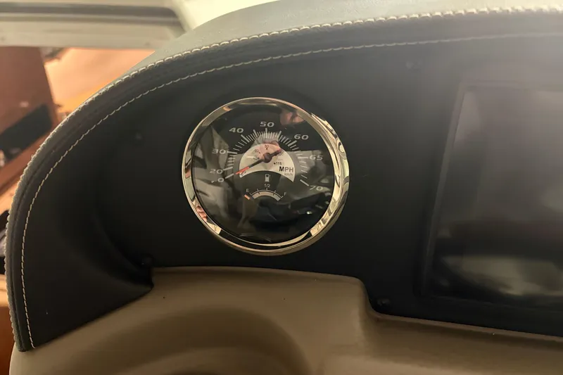 Slide: The Image of Dashboard of 2021 Crownline 264 CR boat with speedometer and fuel gauge. - 22