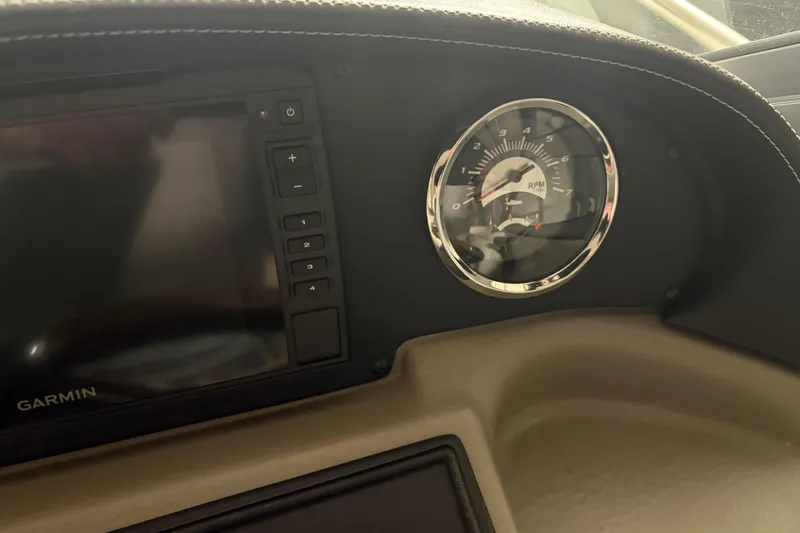 Slide: The Image of Dashboard of 2021 Crownline 264 CR boat with Garmin display and RPM gauge. - 23