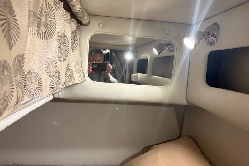 Slide: The Image of Interior cabin of 2021 Crownline 264 CR boat with mirror and lighting. - 34