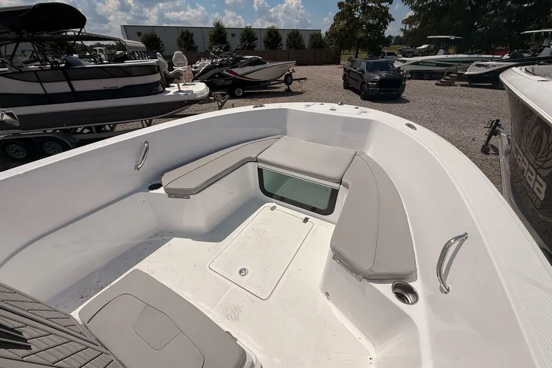 Slide: The Image of 2026 Wellcraft 202 Fisherman boat interior with cushioned seating and storage compartments. - 15