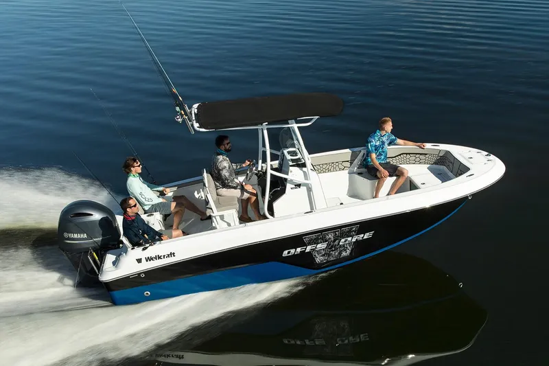 Slide: The Image of Manufacturer Provided Image: 2026 Wellcraft 202 Fisherman boat cruising on calm water with four passengers. - 26