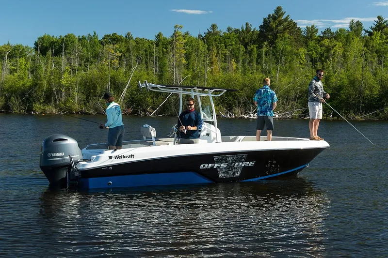 Slide: The Image of Manufacturer Provided Image: 2026 Wellcraft 202 Fisherman boat with anglers on a serene lake. - 27