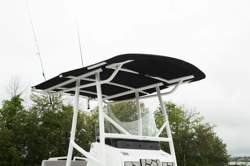 Slide: The Image of Manufacturer Provided Image: 2026 Wellcraft 202 Fisherman boat with T-top against a cloudy sky. - 28