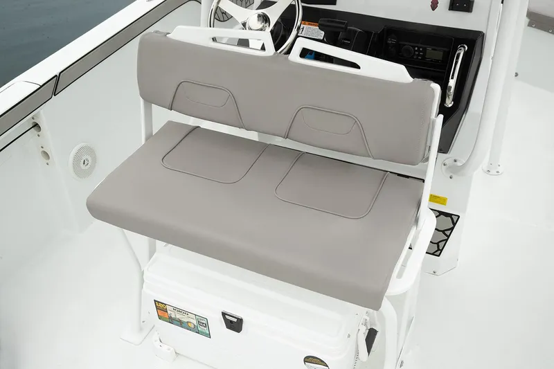 Slide: The Image of Manufacturer Provided Image: 2026 Wellcraft 202 Fisherman boat interior with cushioned seating and steering console. - 36