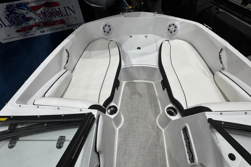 Slide: The Image of 2026 Stingray 191 DC boat interior with white seating and modern design. - 10