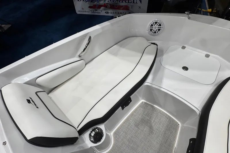 Slide: The Image of 2026 Stingray 191 DC boat interior with white cushioned seating and speaker. - 11