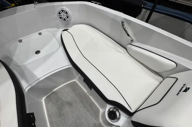 Slide: The Image of Interior of 2026 Stingray 191 DC boat with white seating and modern design. - 12