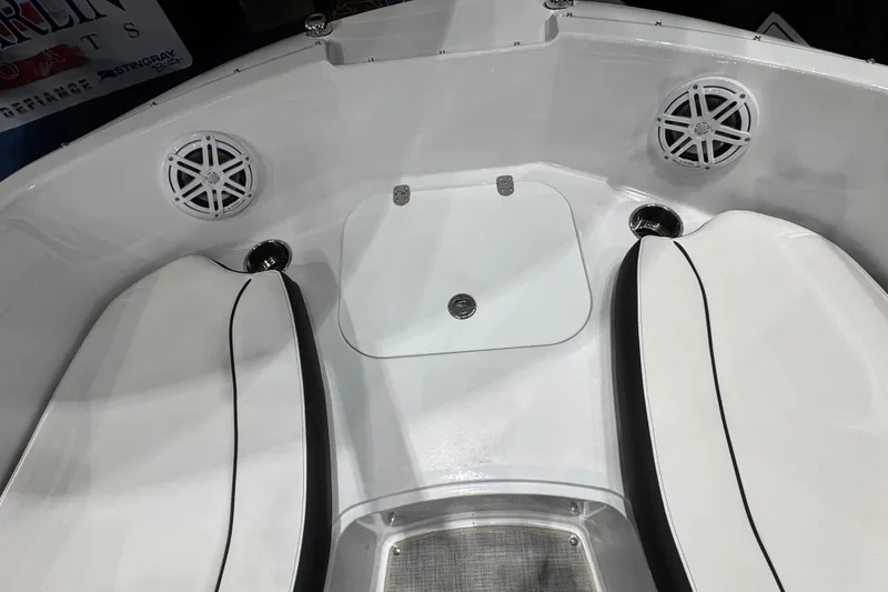 Slide: The Image of Interior of 2026 Stingray 191 DC boat with white seating and speakers. - 13