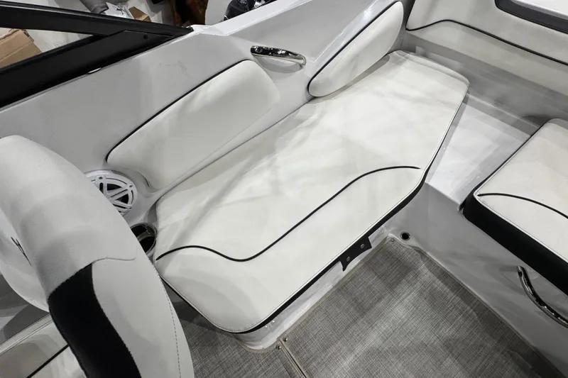 Slide: The Image of 2026 Stingray 191 DC boat interior with white cushioned seating and speaker. - 16