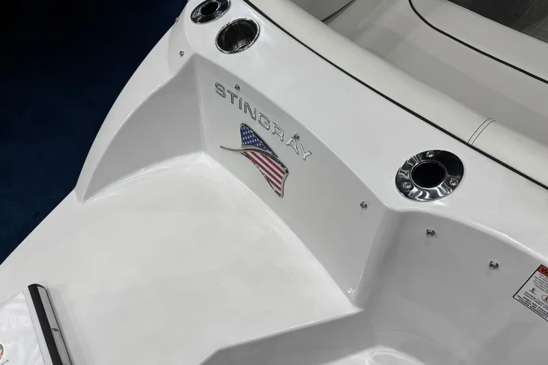 Slide: The Image of 2026 Stingray 191 DC boat with American flag emblem and cup holders. - 19