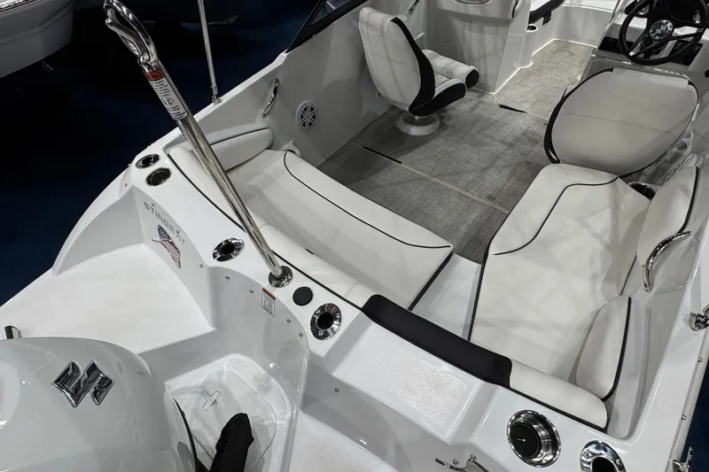 Slide: The Image of 2026 Stingray 191 DC boat interior with white seating and modern design. - 4