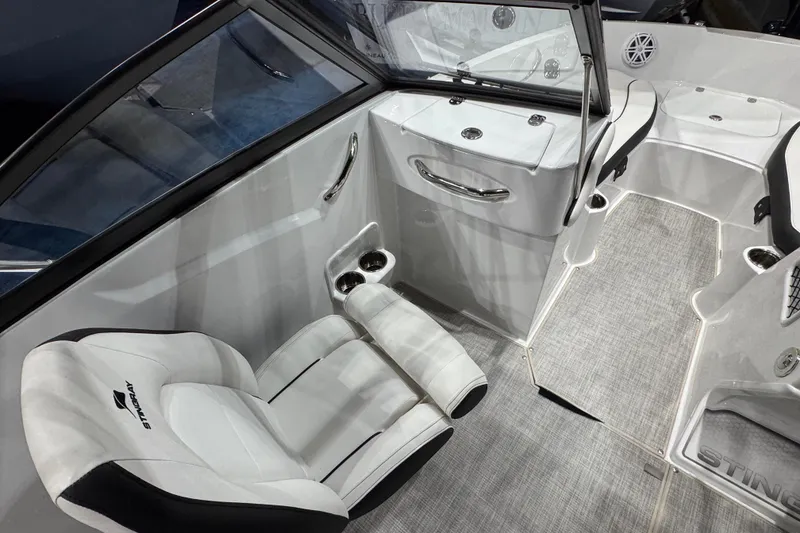 Slide: The Image of 2026 Stingray 191 DC boat interior with white seating and modern design. - 8