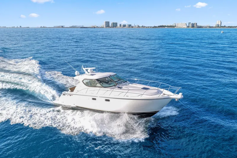 The Image of 2008 Tiara Yachts 4300 Sovran cruising on open blue water. - 0