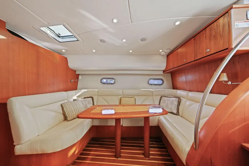 Slide: The Image of Luxurious interior of 2008 Tiara Yachts 4300 Sovran with elegant seating and wooden accents. - 16